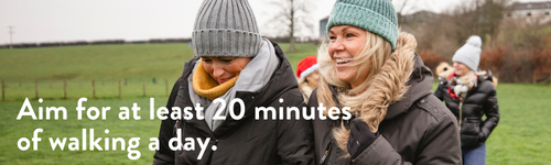 Women walking outdoors. Aim for 20 minutes of walking each day.